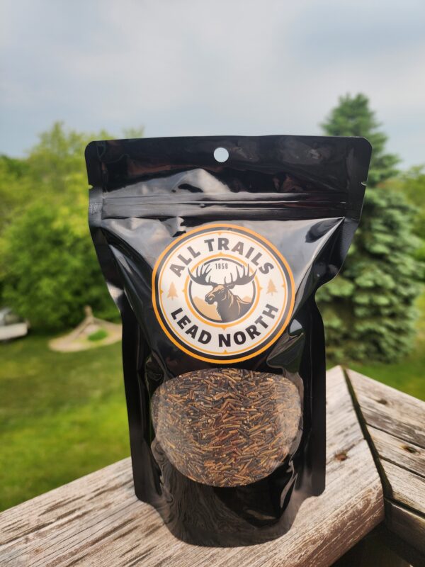 16 oz bag of cultivated wild rice from All Trails Lead North on rustic background
